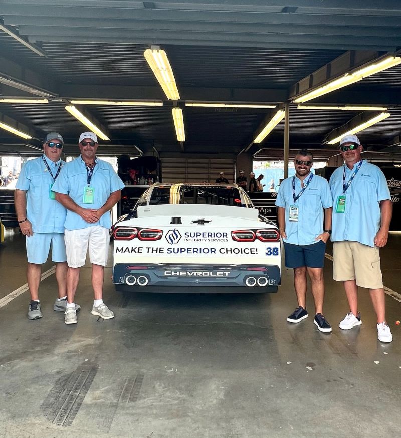SIS teammates with the No. 38 in the garage after the Winn-Dixie 250.